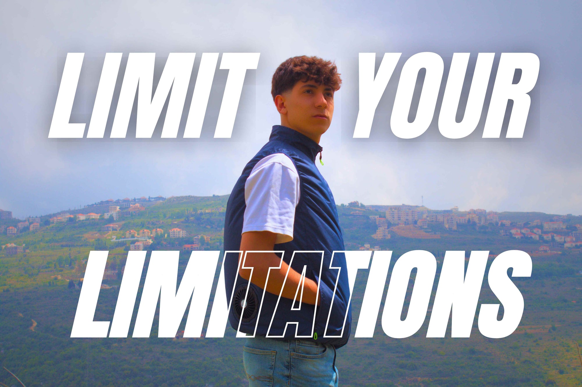 Person standing outdoors wearing a Naseem blue cooling jacket equipped with fans, with 'Limit Your Limitations' text overlay